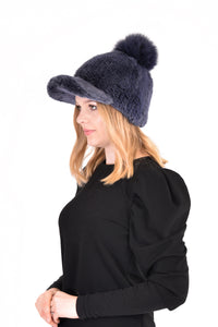 Knitted mink cap with fox fur pom pom