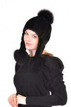 Knitted mink hat with fox pom pom